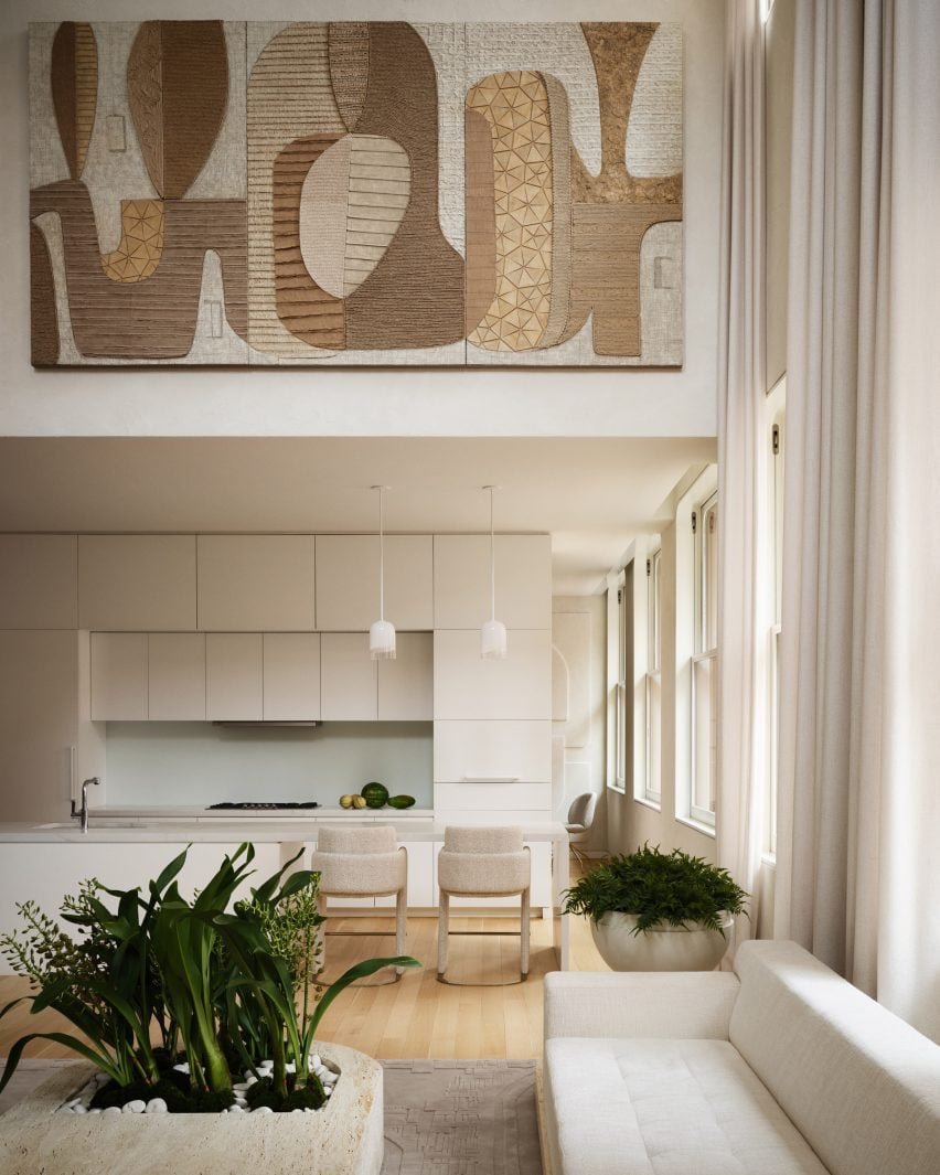 Cocina minimalista vista desde el salón de doble altura